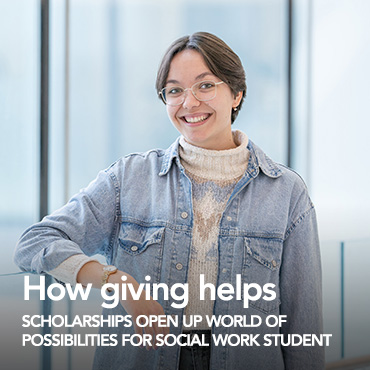 Image of female university student with short brown hair, glasses, a white sweater and pale denim jacket.w